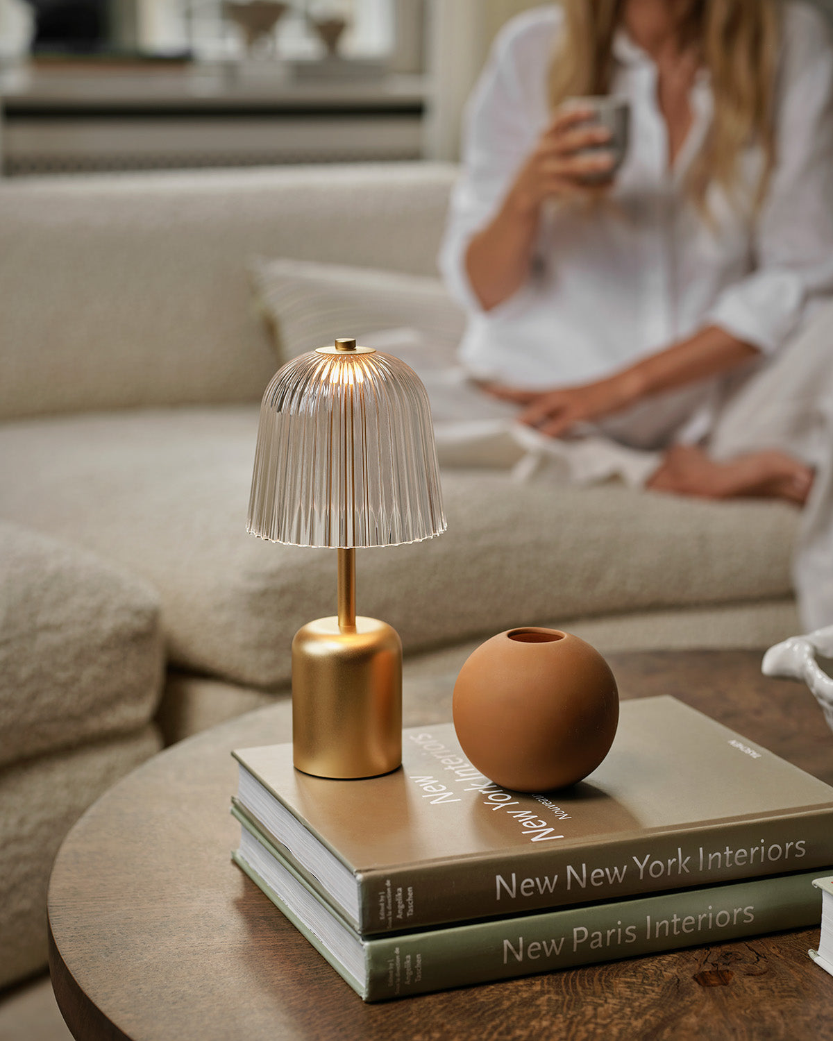 Asteea Table cordless table lamp on top of coffee table books in a cozy living room