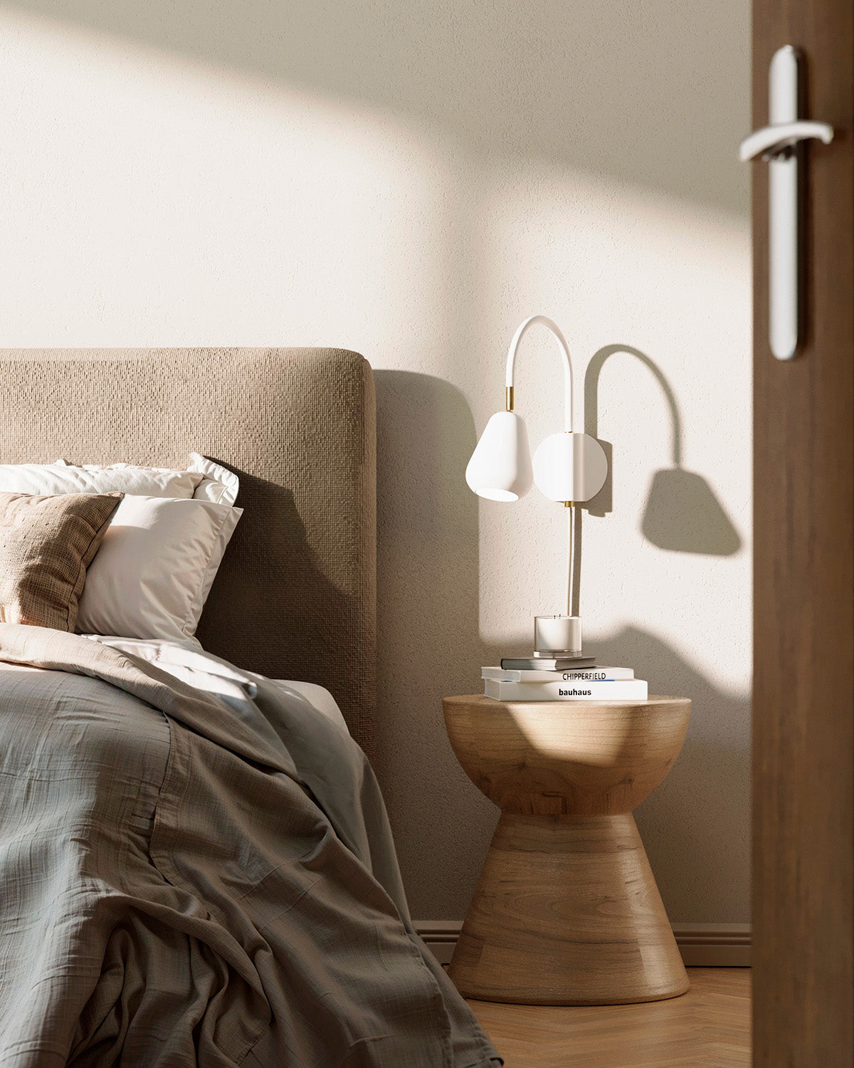 Anoli Spot Wall in a bedroom with a bed and nightstand featuring books and a candle.